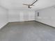 Spacious garage with concrete floor and two white doors at 2412 Cheyenne Ln, Lawrenceville, GA 30044