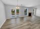 Cozy living room with wood floors, a fireplace, and natural light at 2412 Cheyenne Ln, Lawrenceville, GA 30044