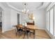 Stylish dining room features hardwood floors, modern chandelier, and neutral decor at 3350 Fieldwood Se Dr, Smyrna, GA 30080