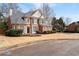 Elegant two-story brick home featuring a well-manicured lawn and symmetrical window design at 3350 Fieldwood Se Dr, Smyrna, GA 30080