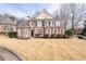 Traditional brick home with meticulously manicured lawn and symmetrical landscaping at 3350 Fieldwood Se Dr, Smyrna, GA 30080