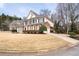 Two-story brick home with black shutters, well-kept lawn, and an attached garage at 3350 Fieldwood Se Dr, Smyrna, GA 30080