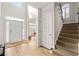 Bright foyer with hardwood floors, staircase, and a view into other rooms at 3350 Fieldwood Se Dr, Smyrna, GA 30080