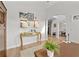 Bright hallway with hardwood floors, decorative art, and transom window at 3350 Fieldwood Se Dr, Smyrna, GA 30080