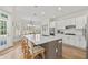 Eat-in kitchen with island, stainless appliances, and white subway tile backsplash for a modern and functional design at 3350 Fieldwood Se Dr, Smyrna, GA 30080