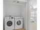 Convenient laundry room with a full-size, modern, side-by-side washer and dryer unit at 3350 Fieldwood Se Dr, Smyrna, GA 30080