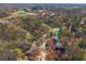 Beautiful aerial view of a home nestled among mature trees in a quiet, established neighborhood near community amenities at 827 Derrydown Way, Decatur, GA 30030