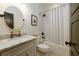 Stylish bathroom featuring marble countertop and shower with white tile at 827 Derrydown Way, Decatur, GA 30030