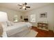 Comfortable bedroom with natural light, ceiling fan, and neutral decor at 827 Derrydown Way, Decatur, GA 30030