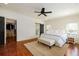 Primary bedroom featuring hardwood floors, ample natural light, and a walk-in closet at 827 Derrydown Way, Decatur, GA 30030