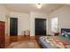 Bedroom featuring hardwood floors, large closets, and a neutral color scheme at 827 Derrydown Way, Decatur, GA 30030