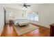 Bright bedroom with hardwood floors, natural light, and a ceiling fan at 827 Derrydown Way, Decatur, GA 30030