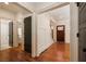 Open foyer featuring hardwood floors and staircase with white trim at 827 Derrydown Way, Decatur, GA 30030