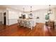 Bright kitchen with a large center island, white cabinetry, stainless steel appliances, and an adjacent breakfast nook at 827 Derrydown Way, Decatur, GA 30030