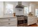 Well-equipped kitchen featuring stainless steel appliances, ample counter space, and stylish cabinetry for efficient meal preparation at 827 Derrydown Way, Decatur, GA 30030