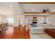 Open concept living room showcasing hardwood floors, a fireplace, and seamless flow to the dining area, perfect for entertaining at 827 Derrydown Way, Decatur, GA 30030