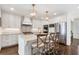 Open-concept kitchen features a center island, pendant lighting, and stainless steel appliances at 1015 Peachtree Battle Cir, Atlanta, GA 30327