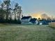 Large backyard with a glimpse of sunset at 2703 Regal Cir, Conyers, GA 30012