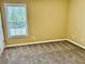 Bedroom featuring neutral carpet and a bright window at 2703 Regal Cir, Conyers, GA 30012