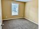 A neutral-colored bedroom with a window, offering a calm and inviting space at 2703 Regal Cir, Conyers, GA 30012