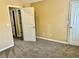 Bedroom with neutral carpet and two doors at 2703 Regal Cir, Conyers, GA 30012
