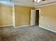 Bedroom featuring neutral walls, neutral carpet, a ceiling fan and a window at 2703 Regal Cir, Conyers, GA 30012