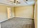 Bedroom featuring neutral walls, neutral carpet, a ceiling fan and a window at 2703 Regal Cir, Conyers, GA 30012