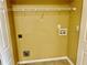 A dedicated laundry area with connections and shelving offers convenience and organization at 2703 Regal Cir, Conyers, GA 30012