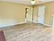 Spacious living room featuring wood-look floors and neutral walls and ample natural light from the window at 2703 Regal Cir, Conyers, GA 30012