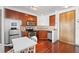 Modern kitchen featuring stainless steel appliances, wood cabinets, and tiled backsplash at 898 Oak Sw St # 3222, Atlanta, GA 30310