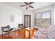 Inviting living area with a ceiling fan, hardwood floors and natural light through the windows at 898 Oak Sw St # 3222, Atlanta, GA 30310