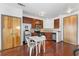 Bright kitchen featuring stainless steel appliances, dark cabinets and a dining area at 898 Oak Sw St # 3222, Atlanta, GA 30310