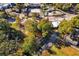 An aerial view shows the property nestled among trees and adjacent to a road and commercial buildings at 1653 Richmond Se Ave, Atlanta, GA 30315