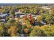 An aerial perspective displays the property situated among lush trees and close to commercial establishments at 1653 Richmond Se Ave, Atlanta, GA 30315