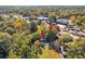 Aerial view features the home surrounded by mature trees and a commercial area nearby at 1653 Richmond Se Ave, Atlanta, GA 30315