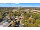 The aerial view shows the home surrounded by lush trees with the city skyline visible in the distance at 1653 Richmond Se Ave, Atlanta, GA 30315