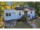 A charming front exterior view showcases a cozy home with a covered porch, inviting entryway, and quaint curb appeal at 1653 Richmond Se Ave, Atlanta, GA 30315