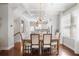 Charming dining area with hardwood floors, modern light fixture, and ample natural light at 1800 Morning Glory Ne Ln, Atlanta, GA 30324