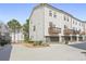 Townhome exterior showing garages, balconies and professional landscaping at 1800 Morning Glory Ne Ln, Atlanta, GA 30324