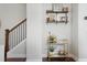 Stylish hallway with staircase and shelving unit at 1800 Morning Glory Ne Ln, Atlanta, GA 30324