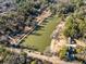 Aerial view showcasing a serene lake surrounded by lush trees and houses at 1135 Banbury Cross, Avondale Estates, GA 30002