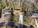 Overhead image of a home with a driveway, lush landscaping, and mature trees at 1135 Banbury Cross, Avondale Estates, GA 30002