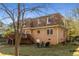 Picture of the backyard of this beautiful home, featuring a grassy lawn and cozy chairs at 1135 Banbury Cross, Avondale Estates, GA 30002