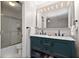 Bathroom features a double sink vanity, a large mirror with lighting, and a glass enclosed shower at 1135 Banbury Cross, Avondale Estates, GA 30002