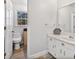 White bathroom featuring a large mirror, toilet, and slate floors at 1135 Banbury Cross, Avondale Estates, GA 30002