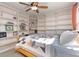 Bright bedroom with ceiling fan and full wall of built-in bookshelves at 1135 Banbury Cross, Avondale Estates, GA 30002