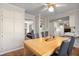 Bright dining room boasts a modern ceiling fan and a wooden dining table that seats four people at 1135 Banbury Cross, Avondale Estates, GA 30002