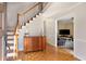 Welcoming foyer with hardwood floors, staircase, and decorative details at 1135 Banbury Cross, Avondale Estates, GA 30002