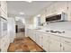 Classic kitchen featuring white cabinets, countertops, and stone tile floors at 1135 Banbury Cross, Avondale Estates, GA 30002