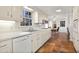 Functional kitchen with white cabinets, a dishwasher, and view of the breakfast nook at 1135 Banbury Cross, Avondale Estates, GA 30002
